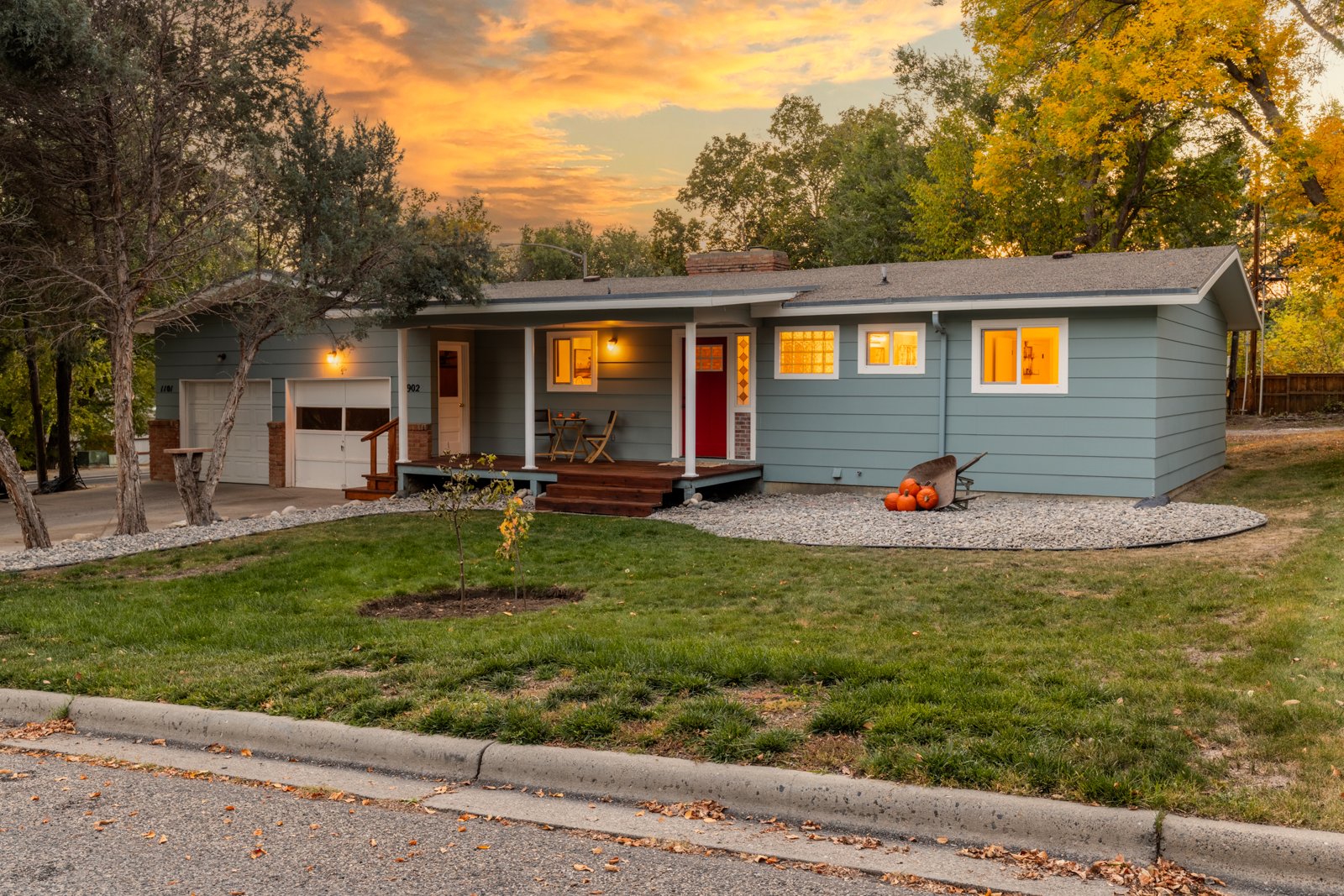 Exterior remodel at twilight with landscaped yard