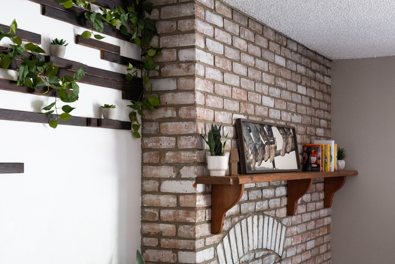 Custom floating shelves on exposed brick